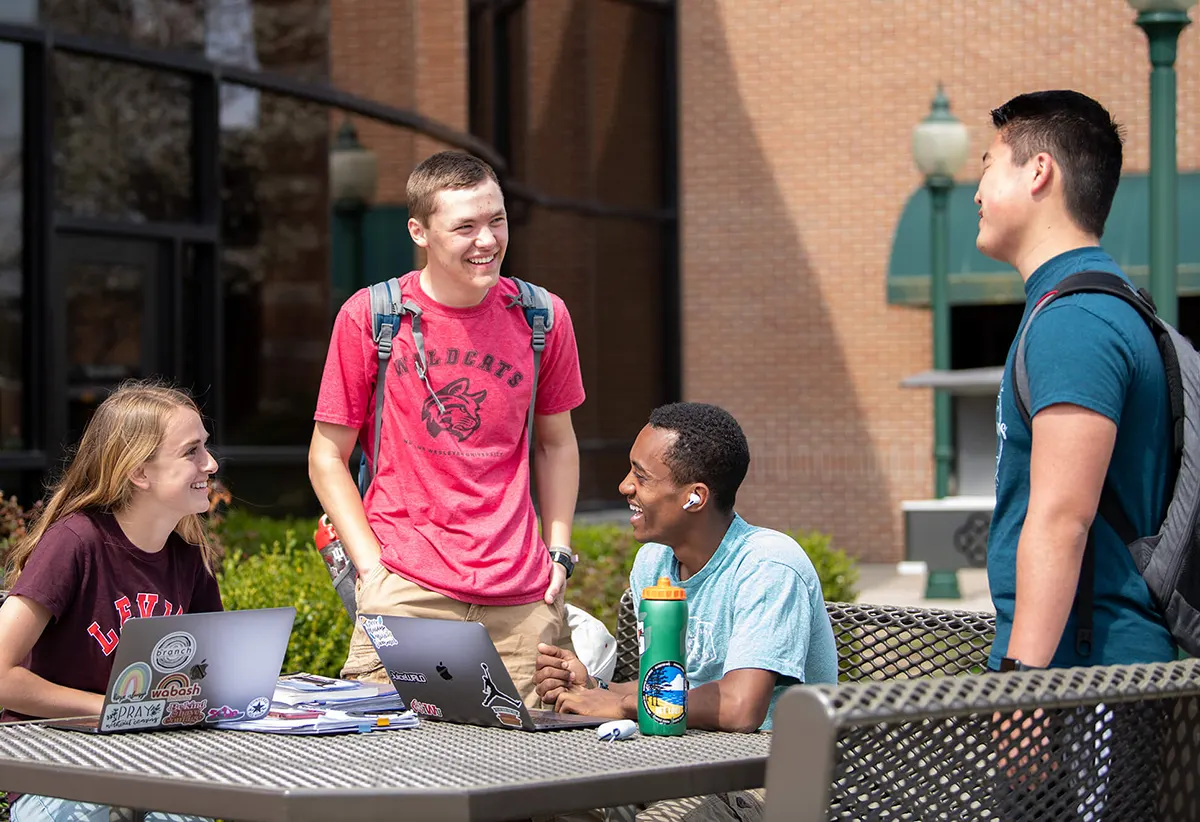 Students talking at table