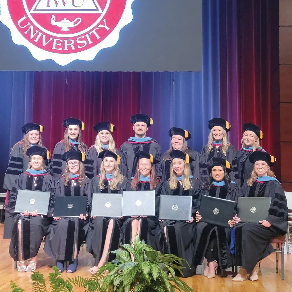 otd graduates on stage at graduation